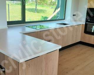 Фото Кухонная столешница  из искусственного камня Grandex с подоконником и барной стойкой
